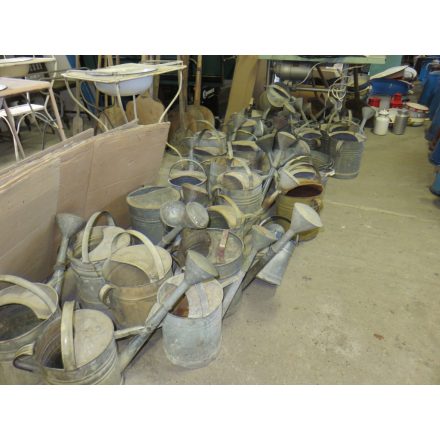 Antique zinc watering cans with spouts