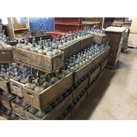 # 5  Antique soda bottles in old wooden crates